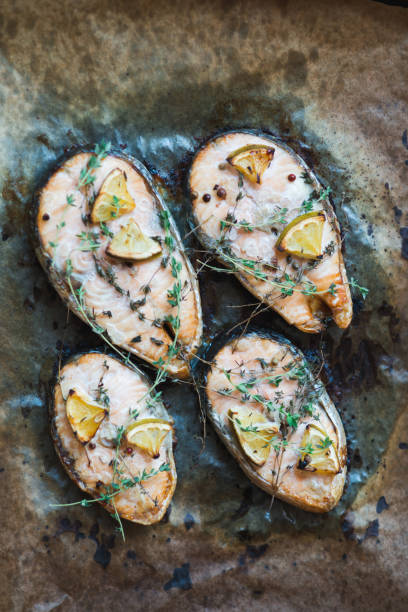 istock Baked red fish steak salmon on paper 657915196