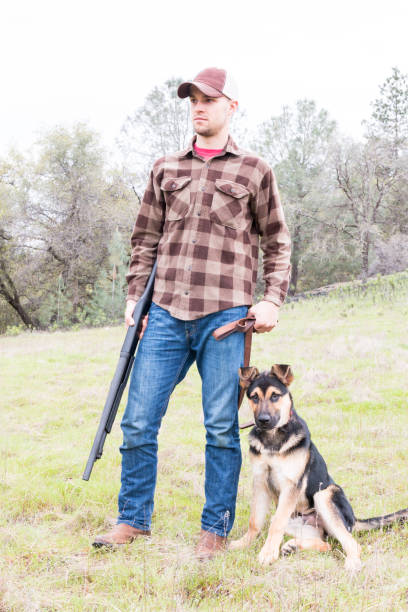 istock Man Hunting With Dog 657915460