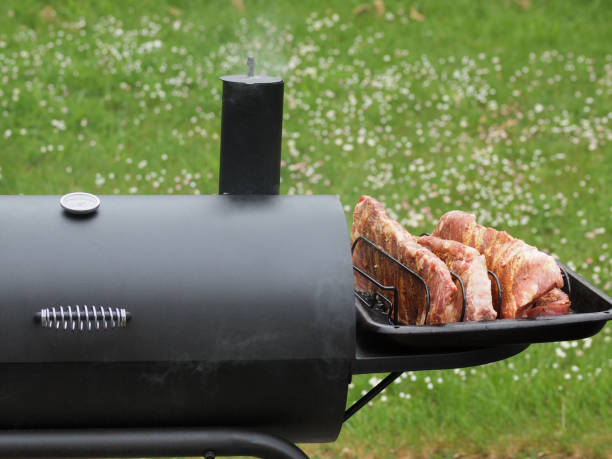 istock Portion of spareribs cooked on a charcoal smoker 657918184