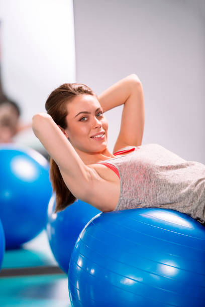 istock Young woman exercise with pilates balls 657921848