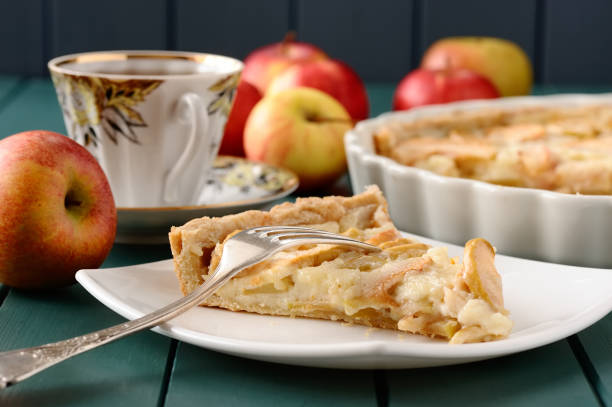 istock Apple tart with cup of tea and whole apples 657922830
