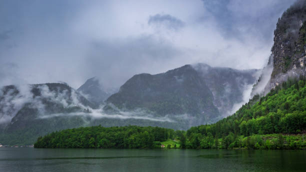 istock Clouds and rain over mountain lake in Hallstatt, Europe 657925540