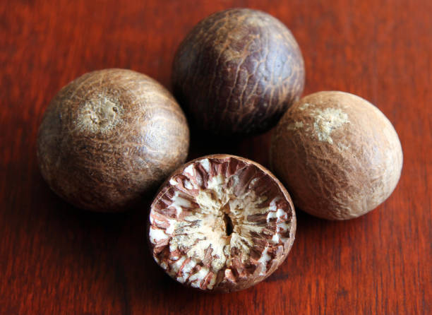 istock ripe fruit of the betel tree (Areca catechu or areca nut palm) 657928608