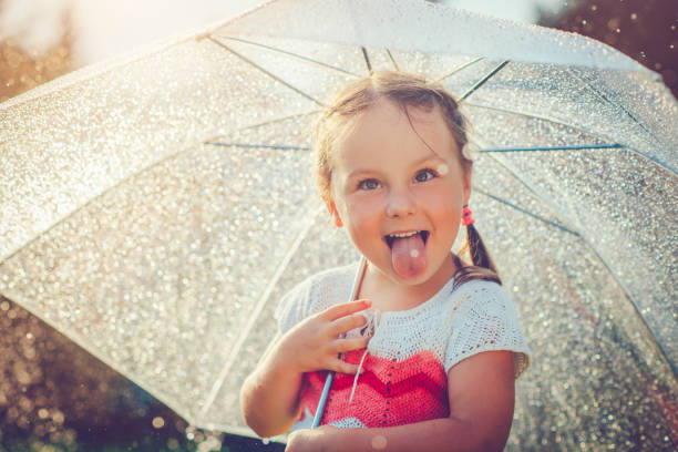 istock Happy girl in rain 657929466