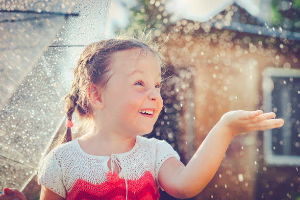 istock Happy girl in rain 657929562