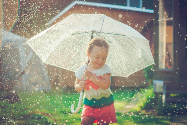 istock Happy girl in rain 657929748