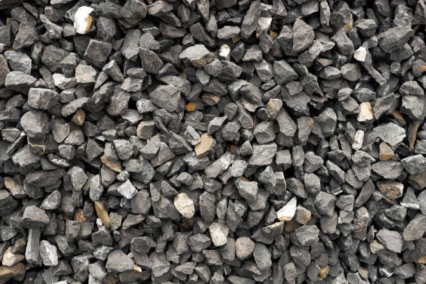 istock aggregate of dark gray and coarse stones, crushed at a stone pit, gravel pattern 657930024