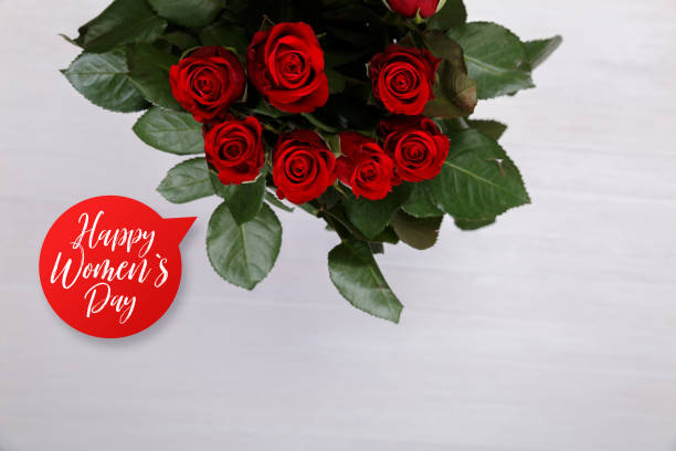 istock Red roses on wooden background. Love design. 657935978
