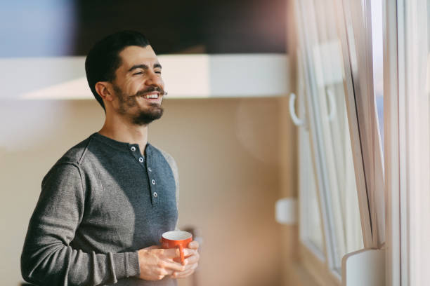 istock Young man at home enjoying coffee 657942252