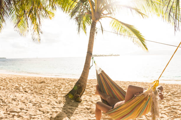 istock Senior man in hammock on the beach 657946122