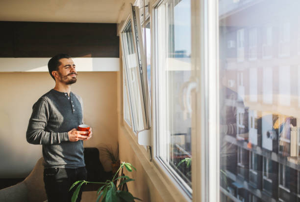 istock Young man at home enjoying coffee 657946260