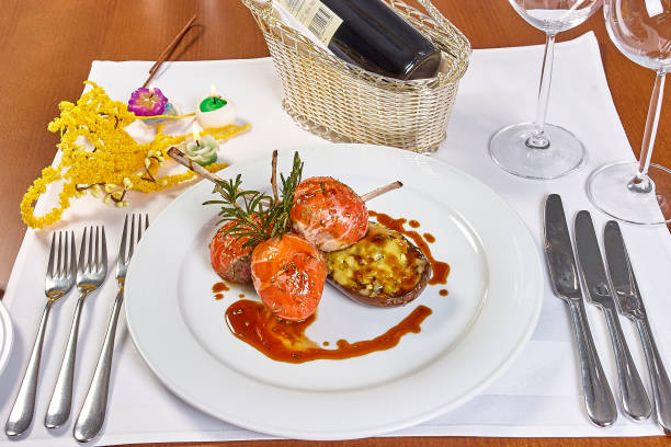 istock Image of lamb chops on a bed of vegetables Eggplant stuffed with vegetables 657965194