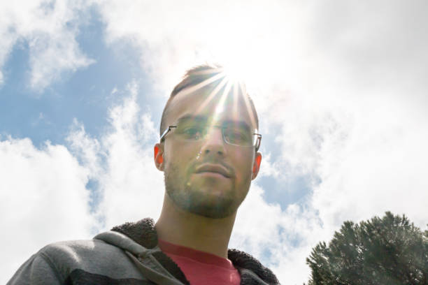 istock Young Man Looking at Camera With the Sunlight Overhead 657968374