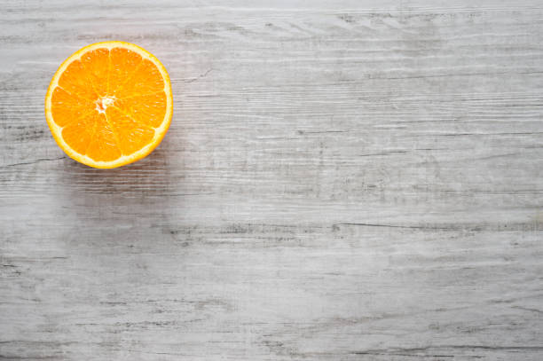 istock Slice of fresh oranges on white wood background 657968710