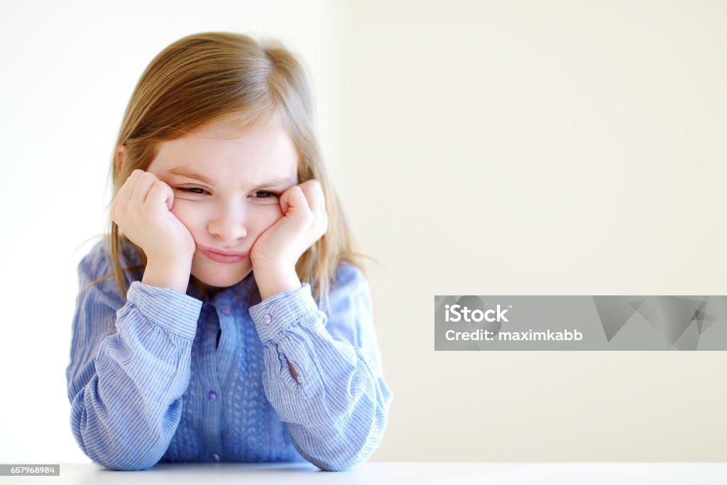Little angry or bored girl portrait Little angry or bored girl portrait at home Child Stock Photo