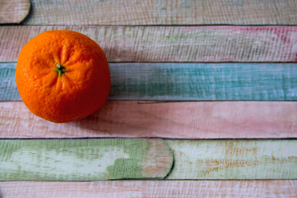 Fresh lime and lemon citrus fruits on wooden background. Copy and paste your own text. Empty space next to yellow and green juicy fruits on warm wooden bakground.