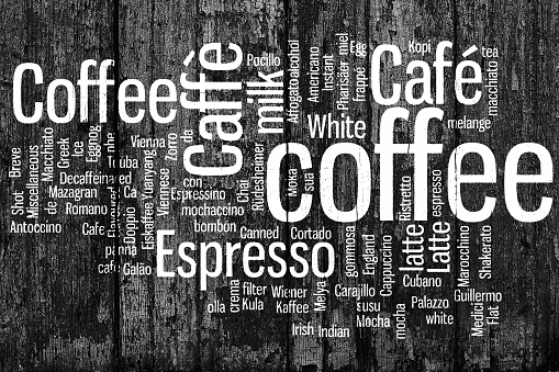 Coffee. All types of coffee, coffee drink. Conceptual word cloud, creative art illustration on wooden boards. The natural background. Black and white image.
