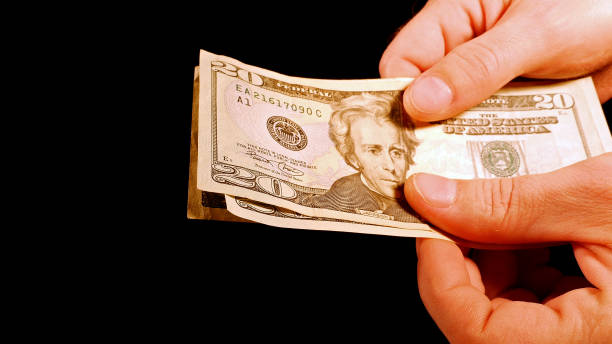 istock Counting money cash dollars bills in hands 657975442