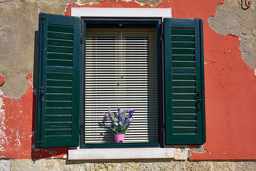 Burano island, Venice. Decorated window. Colorful houses island and landmark of Veneto region, Italy