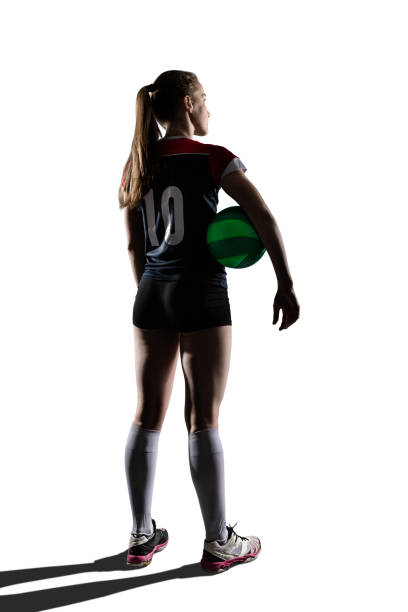 istock Female volleyball player standing with ball 657984034
