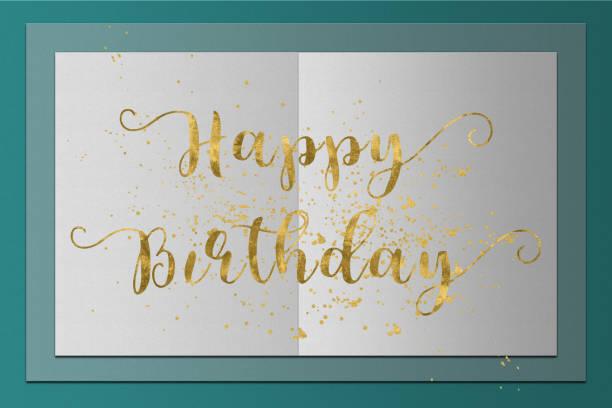 istock Happy Birthday card gold words on paper background 657984192