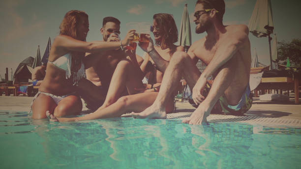 istock Friends chilling at the pool 657984884
