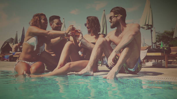istock Friends chilling at the pool 657984888