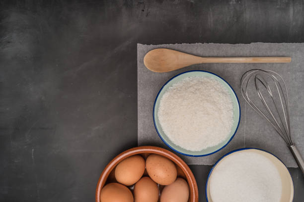 istock Ingredients for baking a cookies. Recipe for coconut macaroons on chalkboard table 657988276