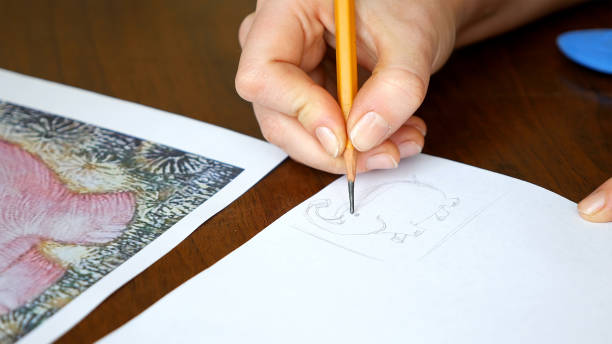 istock Female artist draws a pencil sketch in art studio 657993858