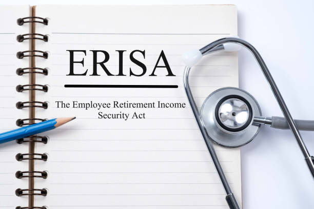 istock Stethoscope on notebook and pencil with ERISA (The Employee Retirement Income Security Act) words as medical concept. 657994112