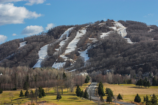 ski hill with golf course in spring time
