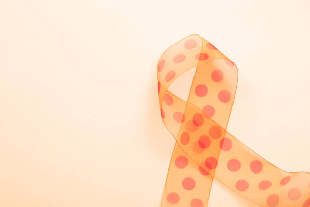 istock Orange ribbon isolated on white 658020840