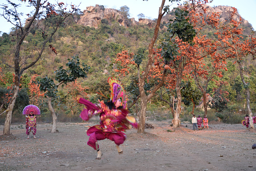 Indian traditional Chau dancers perform a mythological act  at Ajodhya Hill, Purulia, West Bengal, Chau Dance is occupying a significant position in the Dance tradition of West Bengal, while the faces of the Chau Dancers are covered with masks of various mythical characters, the expressions of the form are shown through movements of the hands and feet. Vigorous jumps, hops and other similar energetic moves of the Dancers set the mood of Chau.