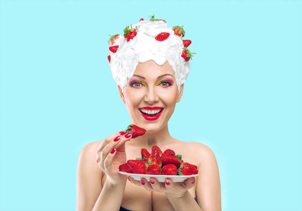 Beautiful woman with strawberry fashion portrait