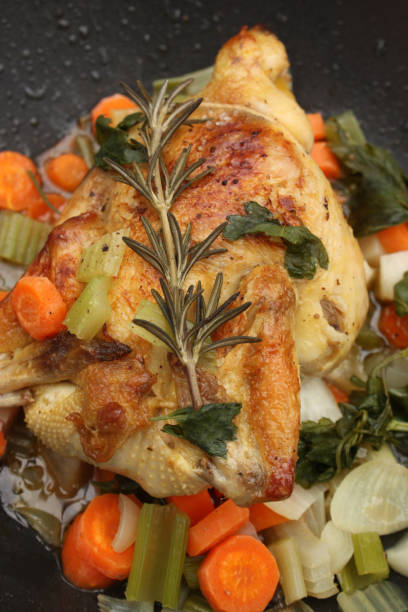 istock Roast chicken in casserole with vegetables and rosemary 658030272