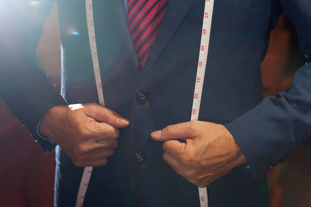 istock Tailor measuring of businessman jacket 658038770