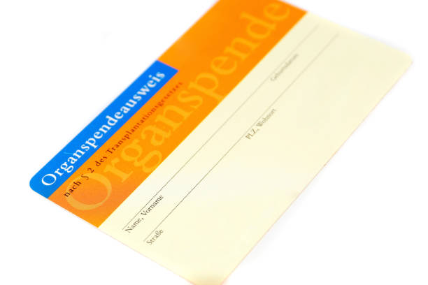Organ donor card Organ donor card in front of white background hospital card stock pictures, royalty-free photos & images