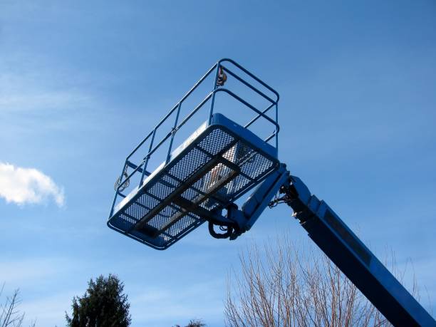 istock Boom lift reaching high up. 658042284