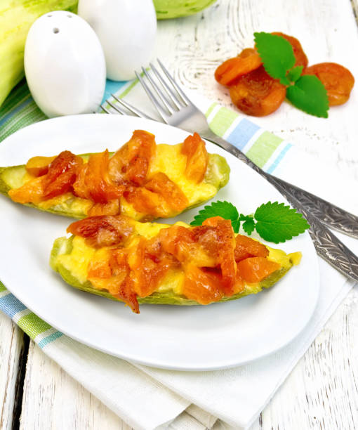 istock Courgettes in spicy sauce with dried apricots on light board 658050752