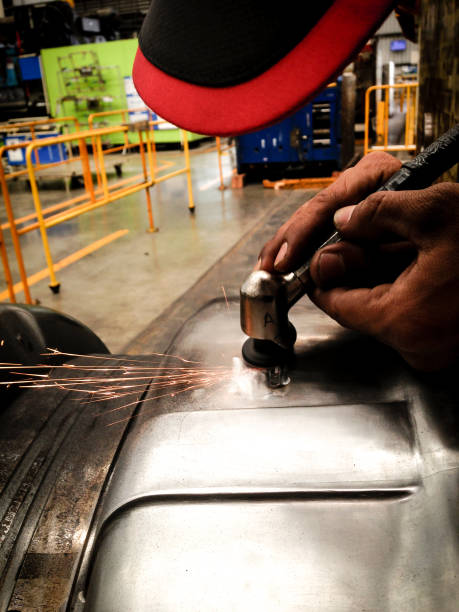 istock closeup asian technician man manual grinding at surface of mold 658051448