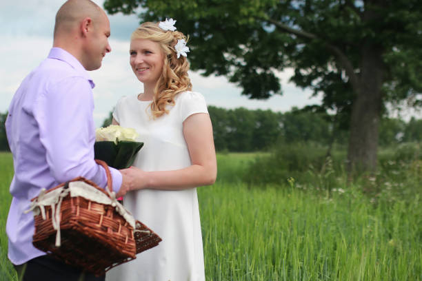 istock Couple lovers walking in field in summer day 658051902