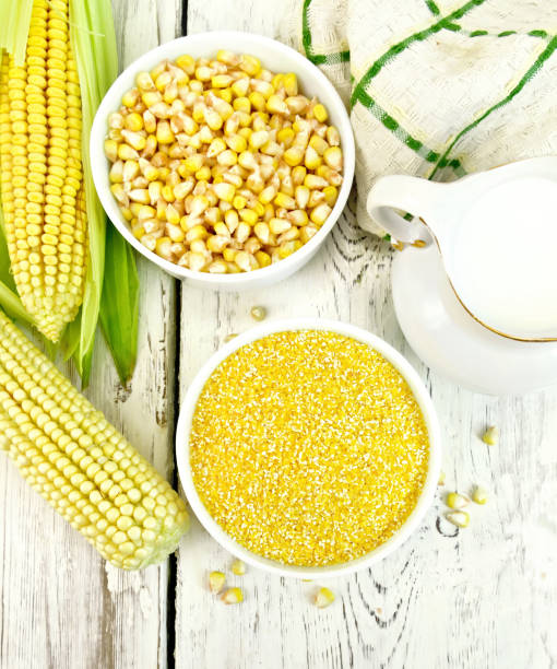 istock Corn grits in bowl with milk on board top 658052410