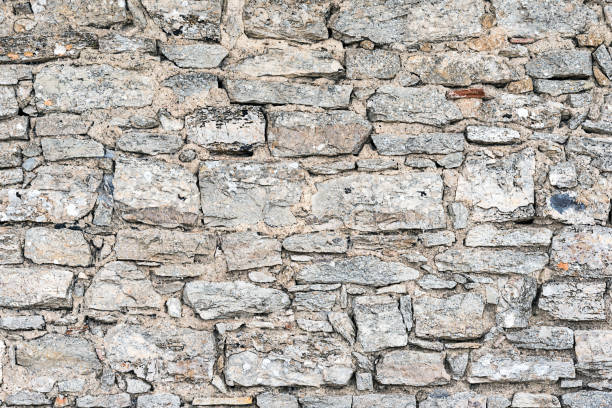 istock Rough wall made of natural stone 658064820