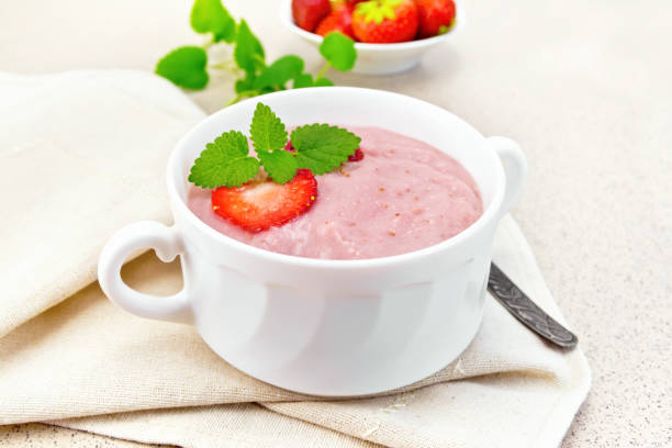 istock Soup strawberry in white bowl on granite table 658065838