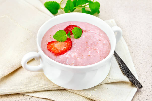 istock Soup strawberry in white bowl on stone table 658065854