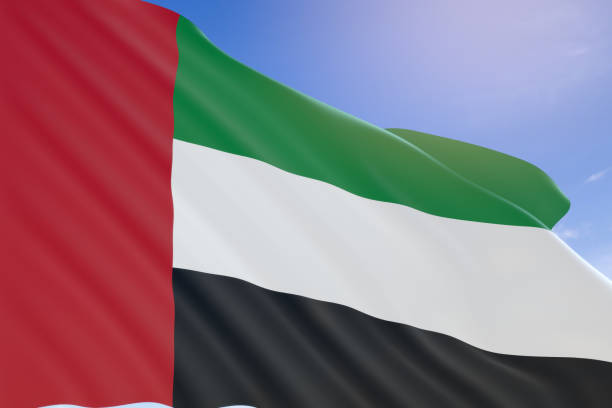 istock 3D rendering of UAE flag waving on blue sky background 658072708