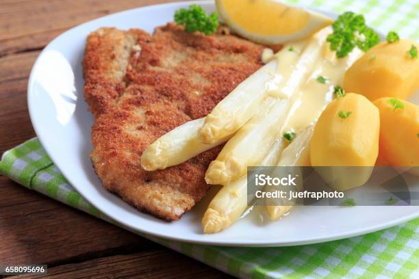 Asparagus With Schnitzel And Boiled Potatoes Stock Photo - Download Image Now - Asparagus, Schnitzel, Biology