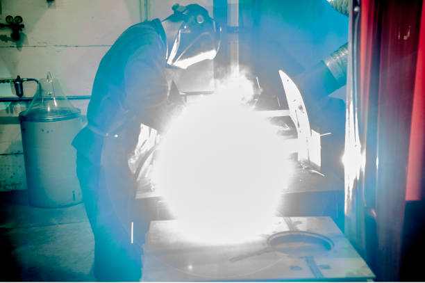 istock Worker welding metal piping using tig welder 658095810