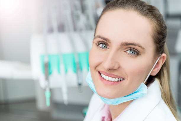 istock Happy female doctor with surgical mask 658096274