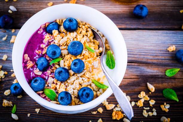 istock Yogurt with granola and blueberry sauce, fresh blueberries and mint 658104482